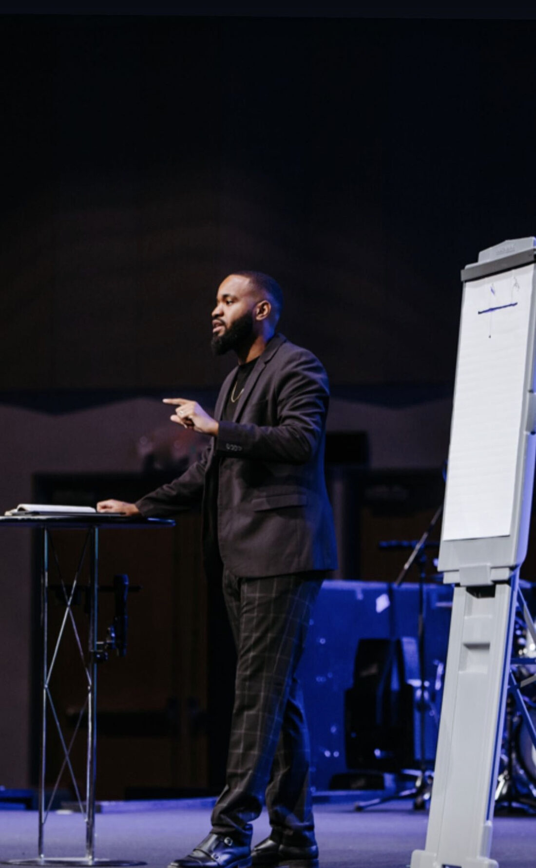 Xavier Maryland teaching beside a flip chart during a leadership session